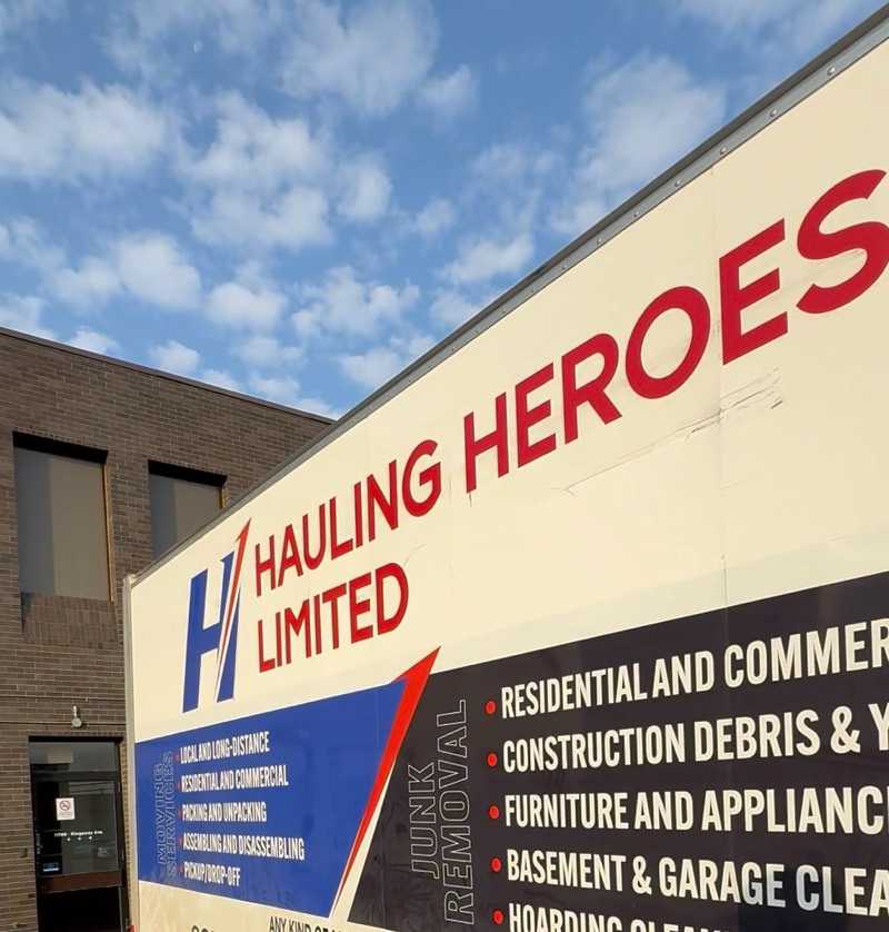 Side of the Hauling Heroes Limited box truck showing the company logo